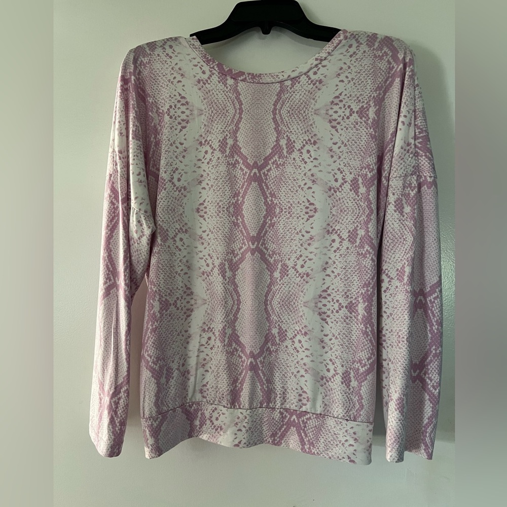 Woman’s long sleeve pink/white snake print top